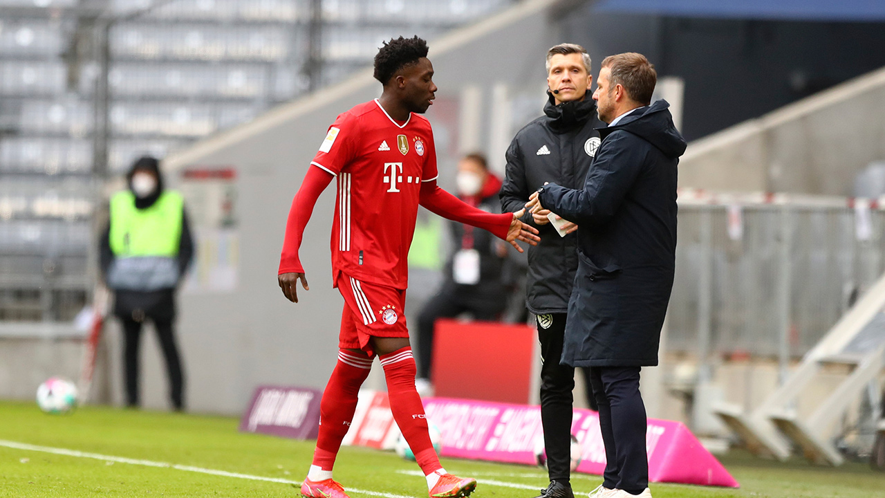 Bayern's Alphonso Davies leaves the pitch after receiving a red card during the German Bundesliga soccer match between FC Bayern Munich and VfB Stuttgart in Munich, Germany, Saturday, March 20, 2021. (Matthias Schrader/Pool via AP)