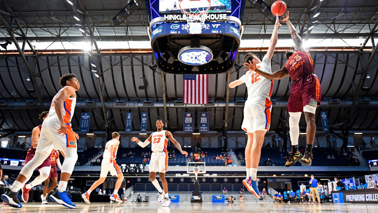 Virginia Tech Tyrece Radford (23) tries to shoot over Florida's Colin Castleton (12) in the first round of the NCAA men's college basketball tournament at Hinkle Fieldhouse in Indianapolis, Thursday, March, 19, 2021. (Brett Wilhelm/Pool Photo via AP)
