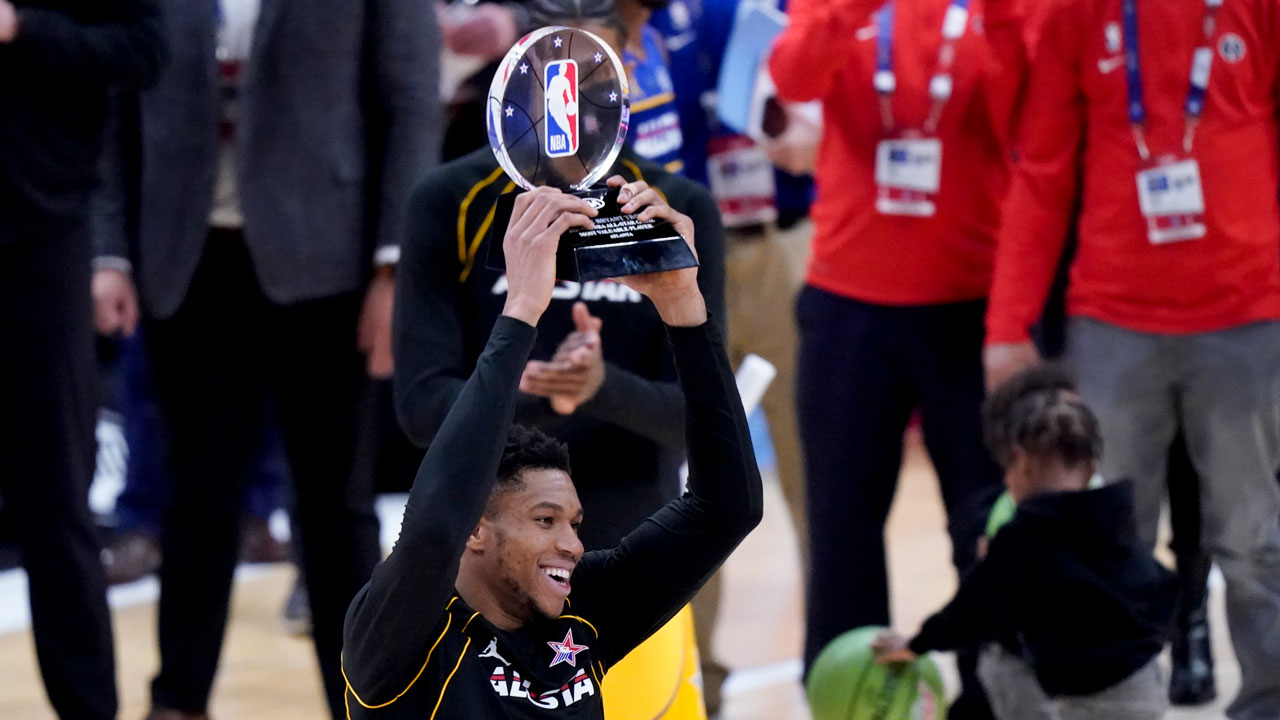 Milwaukee Bucks forward Giannis Antetokounmpo hols up the trophy after basketball's NBA All-Star Game in Atlanta. (Brynn Anderson/AP)