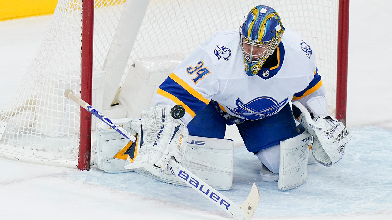 Buffalo Sabres goaltender Jonas Johansson stops a shot on goal during the first period of the team's NHL hockey game against the New Jersey Devils on Tuesday, March 16, 2021, in Newark, N.J. (Frank Franklin II/AP)