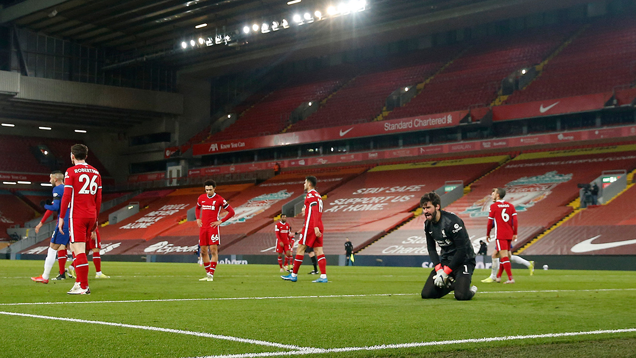 Liverpool's goalkeeper Alisson, second from right, reacts after Chelsea's Mason Mount scored during the Premier League match between Liverpool and Chelsea at Anfield stadium in Liverpool, England, Thursday, March 4, 2021. (Phil Noble, Pool via AP)