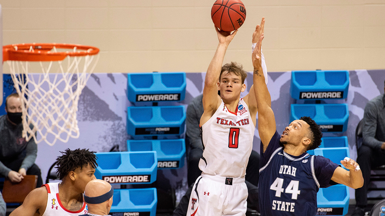 Texas Tech guard Mac McClung (0) shoots a 3-point shot while Utah State guard Marco Anthony (44) defends during the second half of a first round game in the NCAA men's college basketball tournament, Friday, March 19, 2021, at Assembly Hall in Bloomington, Ind. (Doug McSchooler/AP)