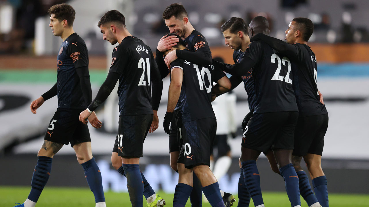 Manchester City's Sergio Aguero, centre foreground, celebrates with team mates after scoring his side's third goal during an English Premier League soccer match. (Catherine Ivill/AP)