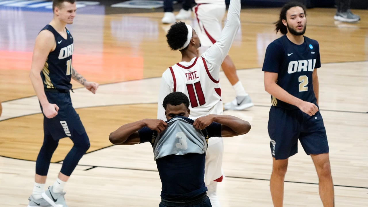 Oral Roberts guard Max Abmas, center, reacts after a Sweet 16 game against Arkansas in the NCAA men's college basketball tournament at Bankers Life Fieldhouse, Saturday, March 27, 2021, in Indianapolis. Arkansas won 72-70. (AP Photo/Jeff Roberson)