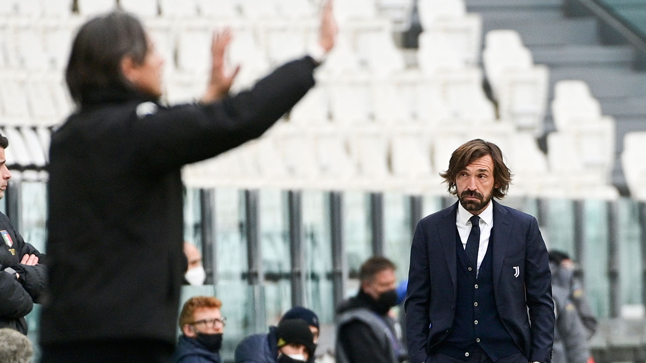 Juventus coach Andrea Pirlo, right, looks at Benevento coach Filippo Inzaghi during a Serie A soccer match between Juventus and Benevento. (Marco Alpozzi/AP)