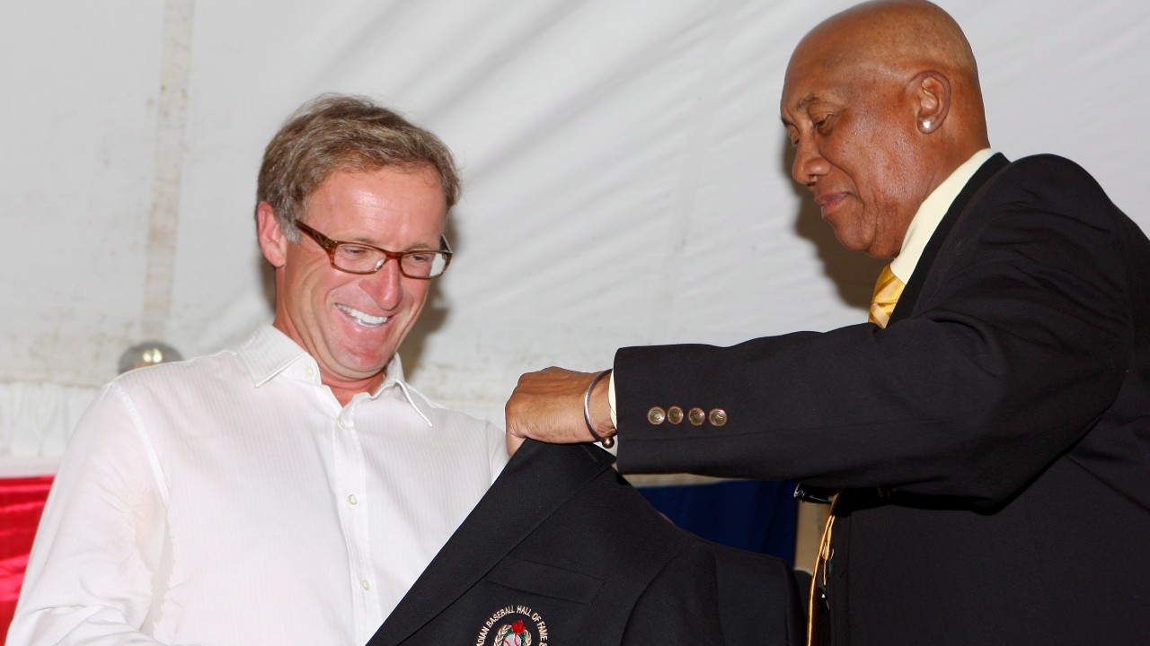 Rheal Cormier receives his jacket from Ferguson Jenkins during his induction to the Canadian Baseball Hall of Fame. THE CANADIAN PRESS/Dave Chidley