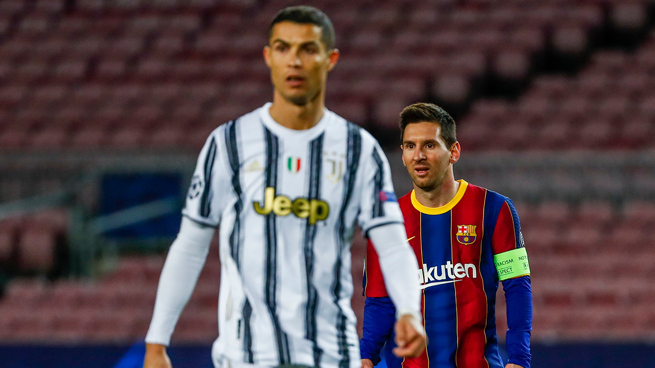 Barcelona's Lionel Messi, right, and Juventus' Cristiano Ronaldo during the Champions League group G soccer match between FC Barcelona and Juventus at the Camp Nou stadium in Barcelona, Spain, Tuesday, Dec. 8, 2020. (Joan Monfort/AP)