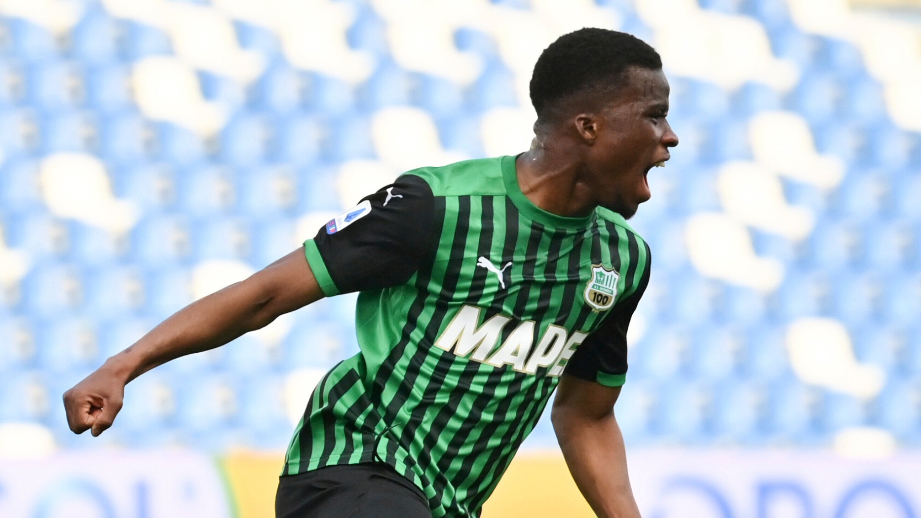 Sassuolo's Hamed Junior Traore celebrates after scoring his side's third goal during a Serie A soccer match between Sassuolo and Verona, at the Mapei stadium, in Reggio Emilia, Italy, Saturday, March 13, 2021. (Massimo Paolone/LaPresse via AP)