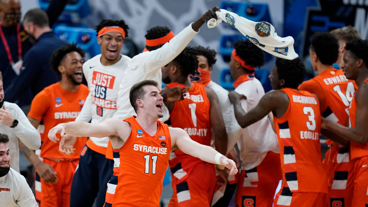 Syracuse's Joseph Girard III celebrates following a second-round game against West Virginia in the NCAA men's college basketball tournament at Bankers Life Fieldhouse. (Darron Cummings/AP)