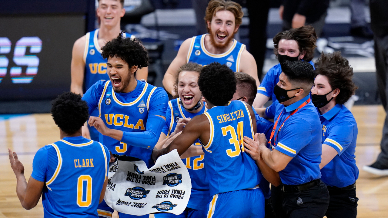 UCLA players celebrate after beating Alabama 88-78 in overtime of a Sweet 16 game in the NCAA men's college basketball tournament at Hinkle Fieldhouse in Indianapolis, Sunday, March 28, 2021. (AJ Mast/AP)
