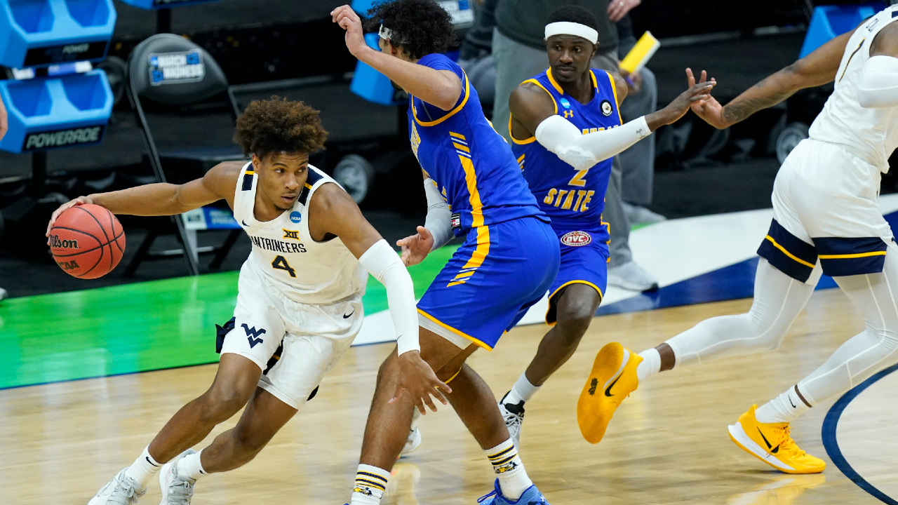 West Virginia's Miles McBride (4) moves the ball against Morehead State during the first half of a college basketball game in the first round of the NCAA tournament at Lucas Oil Stadium Friday, March 19, 2021, in Indianapolis. (Mark Humphrey/AP)
