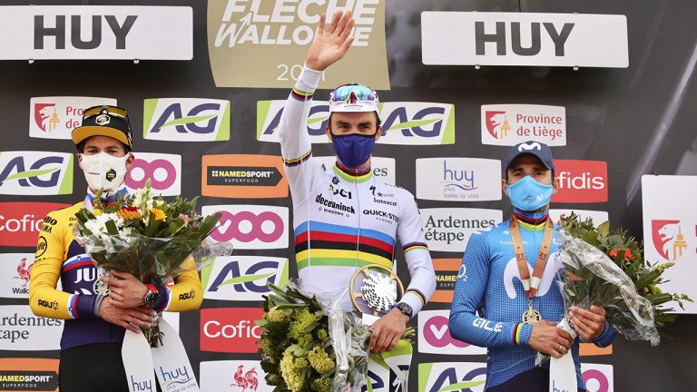 First place France's Julian Alaphilippe of the Deceuninck Quick-Step team, center, celebrates on the podium with second place, Slovenia's Primoz Roglic of the Jumbo Visma team, left, and third place Spain's Alejandro Valverde of the Mobistar team during the Belgian cycling classic and UCI World Tour race Fleche Wallonne. (Olivier Matthys/AP)