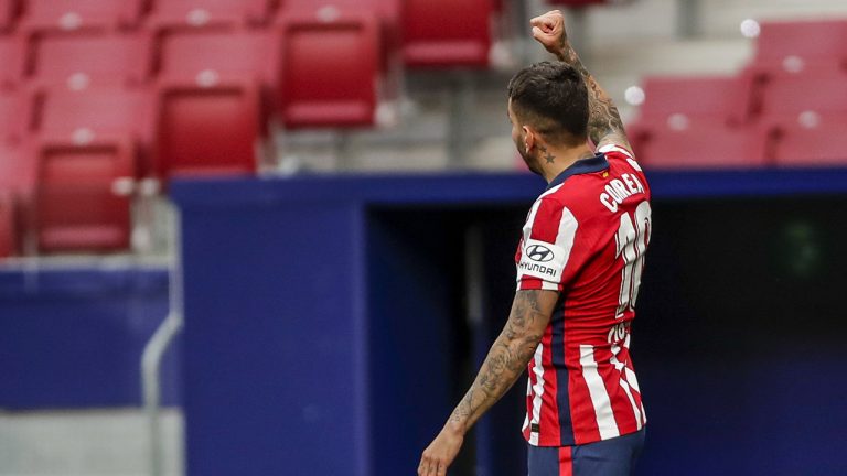Atletico Madrid's Angel Correa celebrartes after scoring his side's first goal during the Spanish La Liga soccer match between Atletico Madrid and Huesca, Thursday, April 22, 2021. (Manu Fernandez/AP)