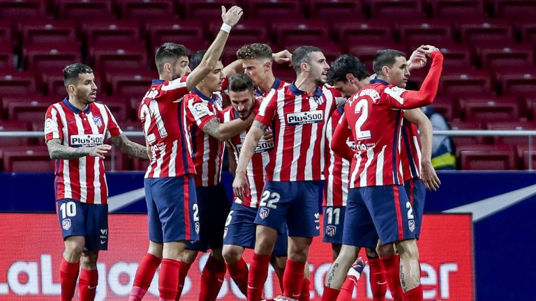 Atletico Madrid's Luis Suarez, center, celebrates with his teammates after scoring his side's first goal during the Spanish La Liga soccer match between Atletico Madrid and Alaves. (Manu Fernandez/AP)
