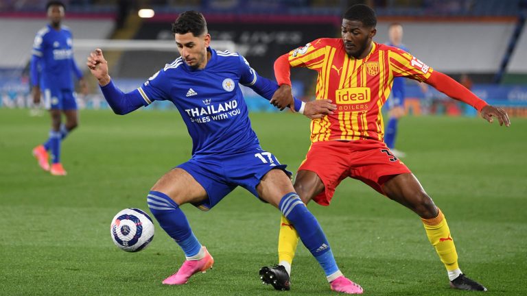 Leicester's Ayoze Perez, left, duels for the ball with West Bromwich Albion's Ainsley Maitland-Niles. (Michael Regan/Pool via AP)