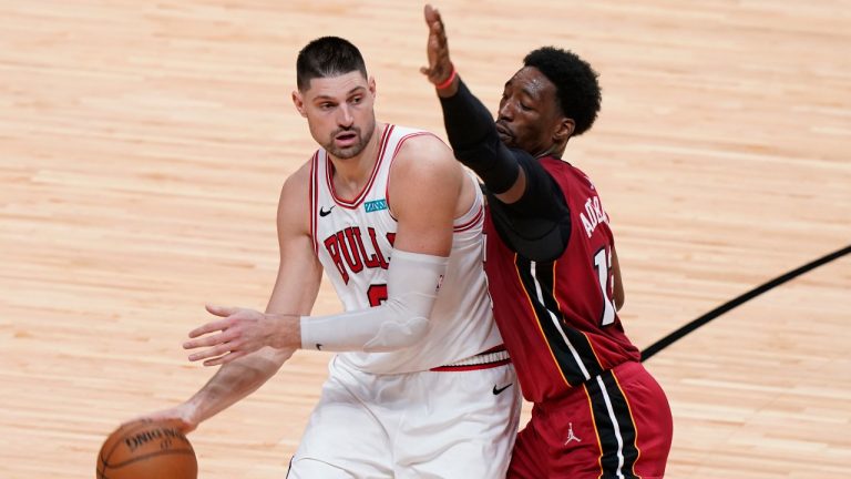Miami Heat center Bam Adebayo (13) defends against Chicago Bulls center Nikola Vucevic during the second half of an NBA basketball game, Saturday, April 24, 2021, in Miami. (Marta Lavandier / AP)