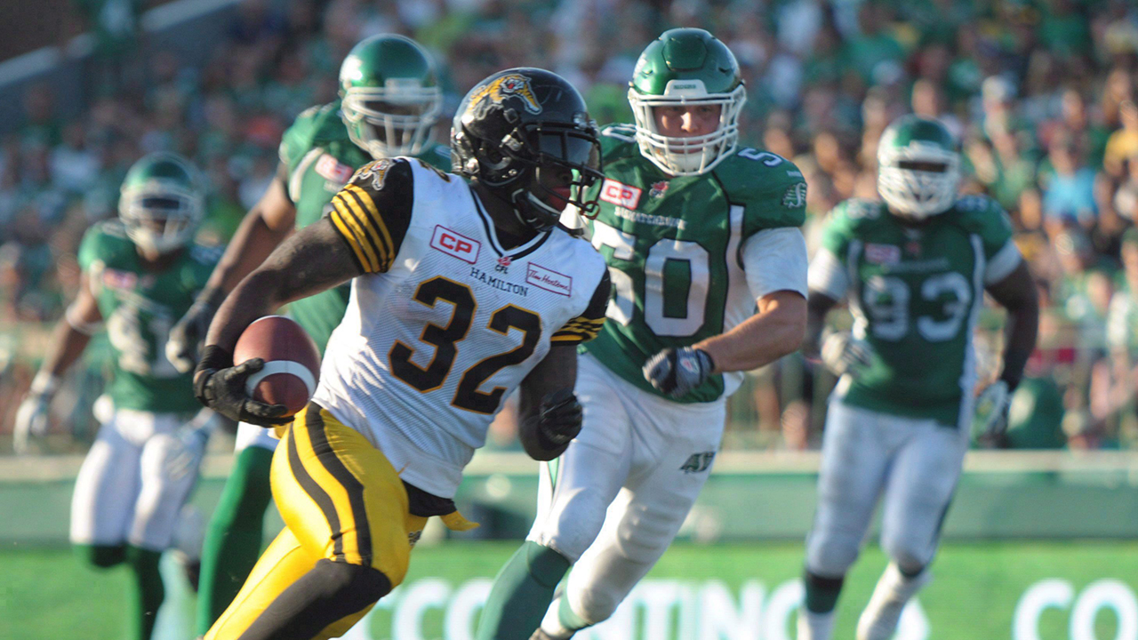 Hamilton Tiger-Cats C.J. Gable picks up yards against the Saskatchewan Roughriders during second half CFL action in Regina on July 26, 2015. (Mark Taylor/CP)