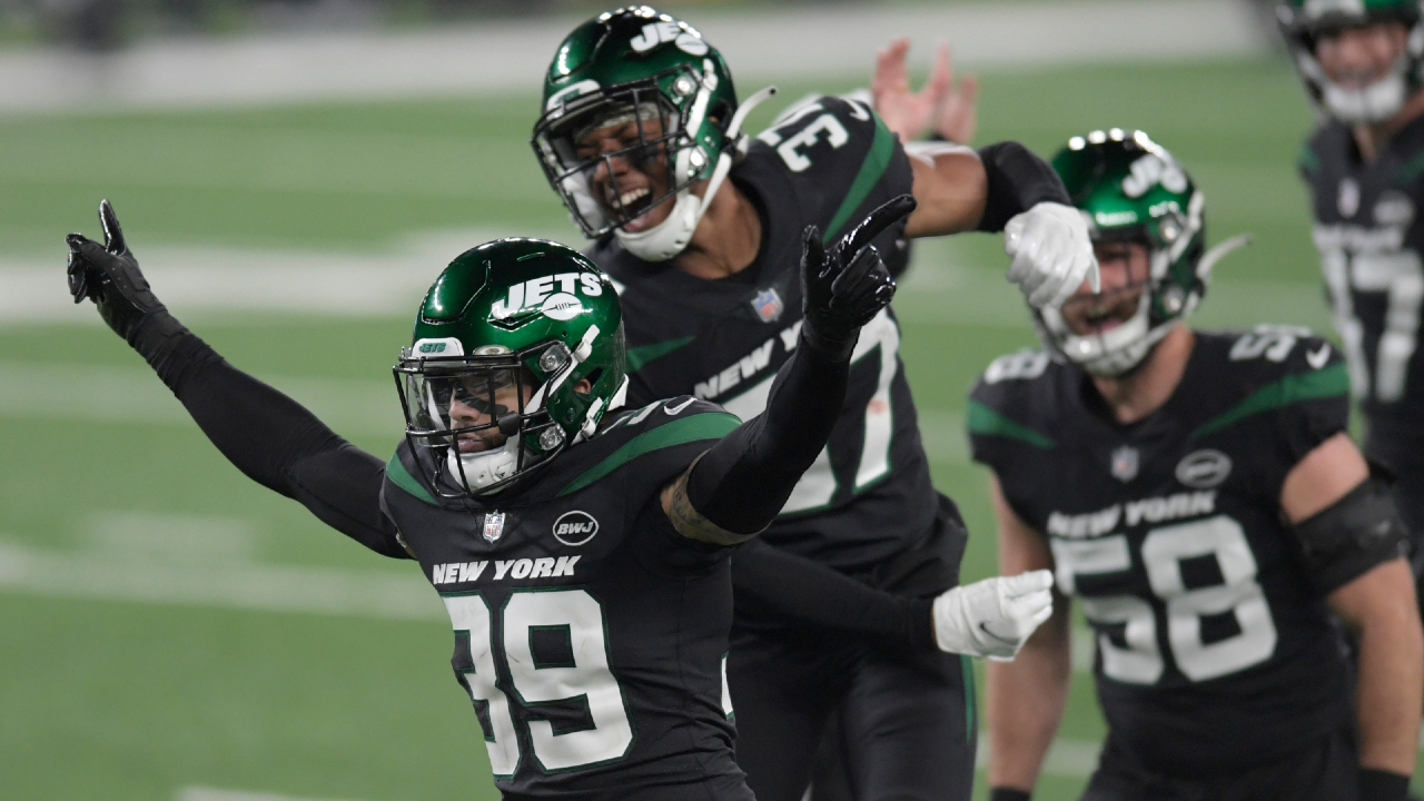 New York Jets' Bennett Jackson, left, celebrates a tackle during the first half of an NFL football game against the New England Patriots, Monday, Nov. 9, 2020, in East Rutherford, N.J. (AP Photo/Bill Kostroun)