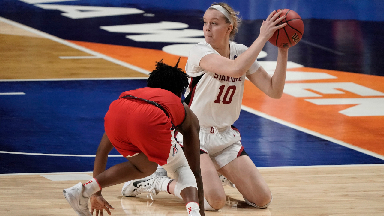 Stanford forward Alyssa Jerome (10) passes over Arizona guard Shaina Pellington, left, during the second half of the championship game in the women's Final Four NCAA college basketball tournament, Sunday, April 4, 2021, at the Alamodome in San Antonio. (AP Photo/Morry Gash)
