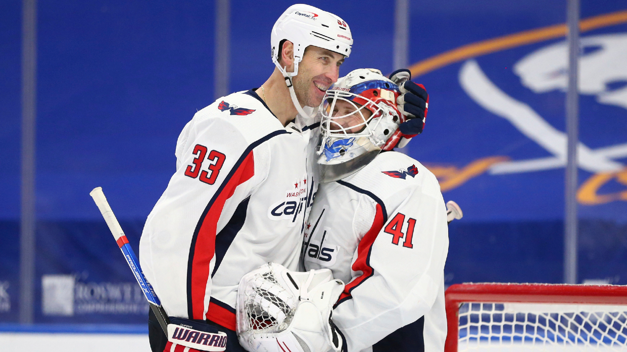 Washington Capitals defenseman Zdeno Chara (33) and goalie Vitek Vanecek (41) celebrate a victory following the third period of an NHL hockey game against the Buffalo Sabres, Friday, April 9, 2021, in Buffalo, N.Y. (AP Photo/Jeffrey T. Barnes)