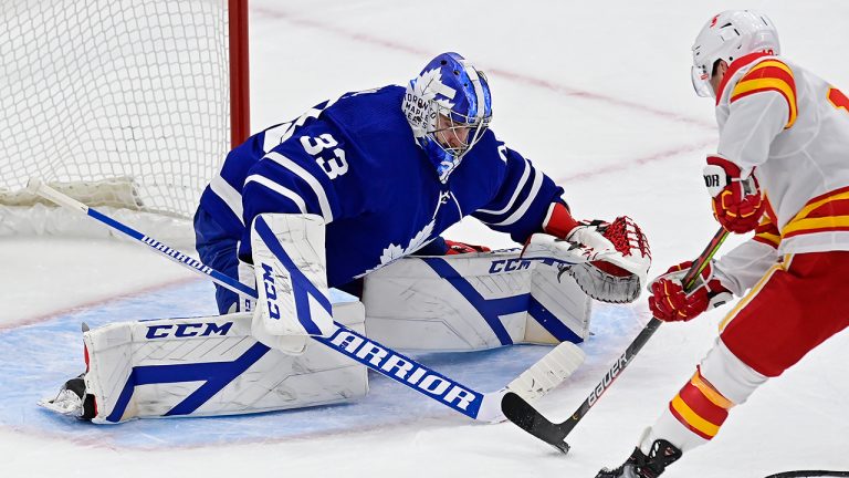 Calgary Flames' Derek Ryan (10) is stopped by Toronto Maple Leafs goaltender David Rittich (33) during second period NHL hockey action in Toronto on Tuesday, April 13, 2021. (Frank Gunn/CP)