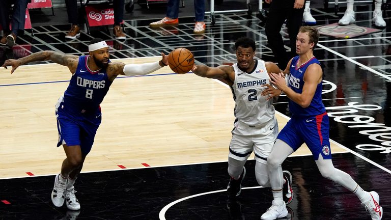 Memphis Grizzlies forward Xavier Tillman (2) vies for loose ball against Los Angeles Clippers forward Marcus Morris Sr., left, and guard Luke Kennard during the second half of an NBA basketball game Wednesday, April 21, 2021, in Los Angeles. (Marcio Jose Sanchez/AP)