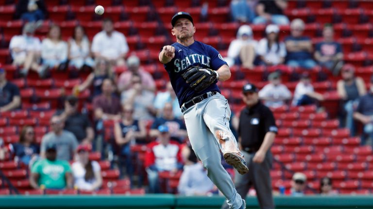 Seattle Mariners' Kyle Seager throws to first base on the ground out by Boston Red Sox's Christian Arroyo during the sixth inning of a baseball game, Saturday, April 24, 2021, in Boston. (AP Photo/Michael Dwyer)