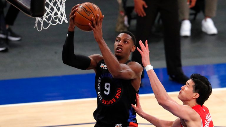 New York Knicks guard RJ Barrett (9) drives to the basket against Toronto Raptors forward Yuta Watanabe (18) during the second half of an NBA basketball game Saturday, April 24, 2021, in New York. (Noah K. Murray/AP)