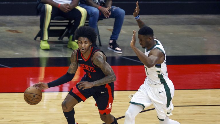 Houston Rockets guard Kevin Porter Jr. (3) dribbles the ball as Milwaukee Bucks forward Thanasis Antetokounmpo (43) defends during the first quarter of an NBA basketball game Thursday, April 29, 2021, in Houston. (Troy Taormina/Pool Photo via AP)