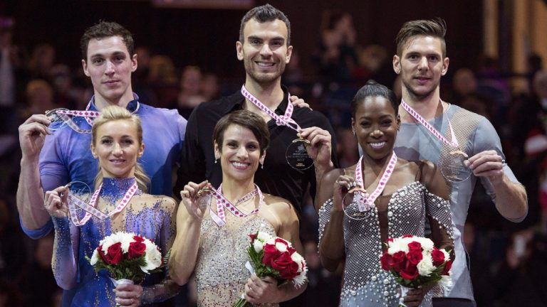 Pairs gold medalists Canada's Meagan Duhamel and Eric Radford, centre, silver medalists Aliona Savchenko and Bruno Massot, left, of Germany and bronze medalists Vanessa James and Morgan Cipres of France show off their medals during victory ceremonies at Skate Canada International in Regina on Saturday, October 28, 2017. (THE CANADIAN PRESS/Paul Chiasson)