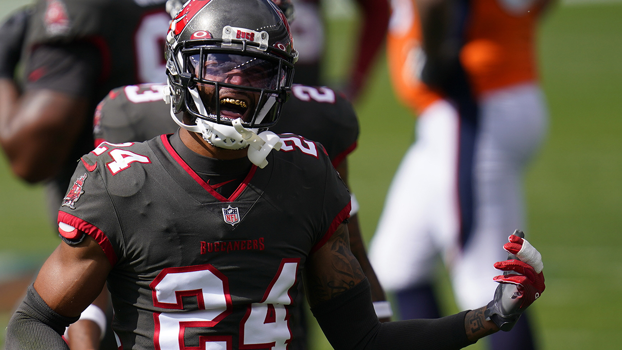 Tampa Bay Buccaneers cornerback Carlton Davis reacts after hauling down Denver Broncos wide receiver K.J. Hamler during the first half of an NFL football game. (David Zalubowski/AP)