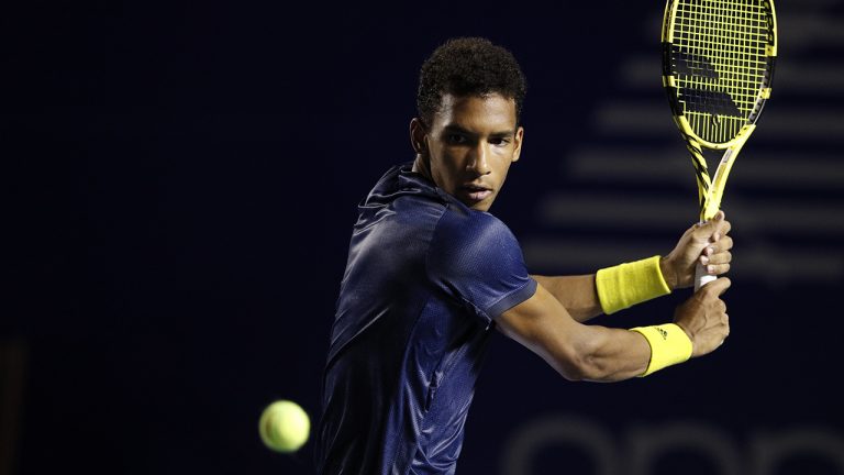 Canada's Felix Auger-Aliassime watches an incoming ball during his quarterfinal match against Greece's Stefanos Tsitsipas. (Rebecca Blackwell/AP)