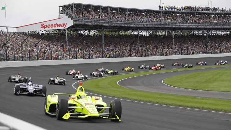 Simon Pagenaud, of France, leads the field through the first turn on the start of the Indianapolis 500 IndyCar auto race at Indianapolis Motor Speedway, in Indianapolis. (AP Photo/Darron Cummings, File)