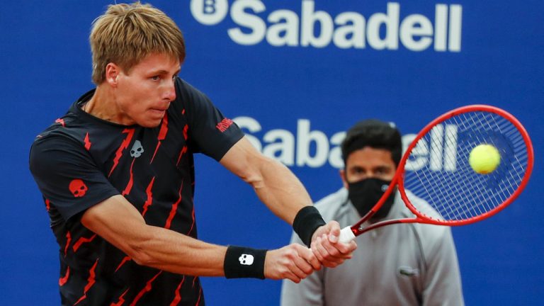 Ilya Ivashka of Belarus returns the ball. (Joan Monfort/AP)