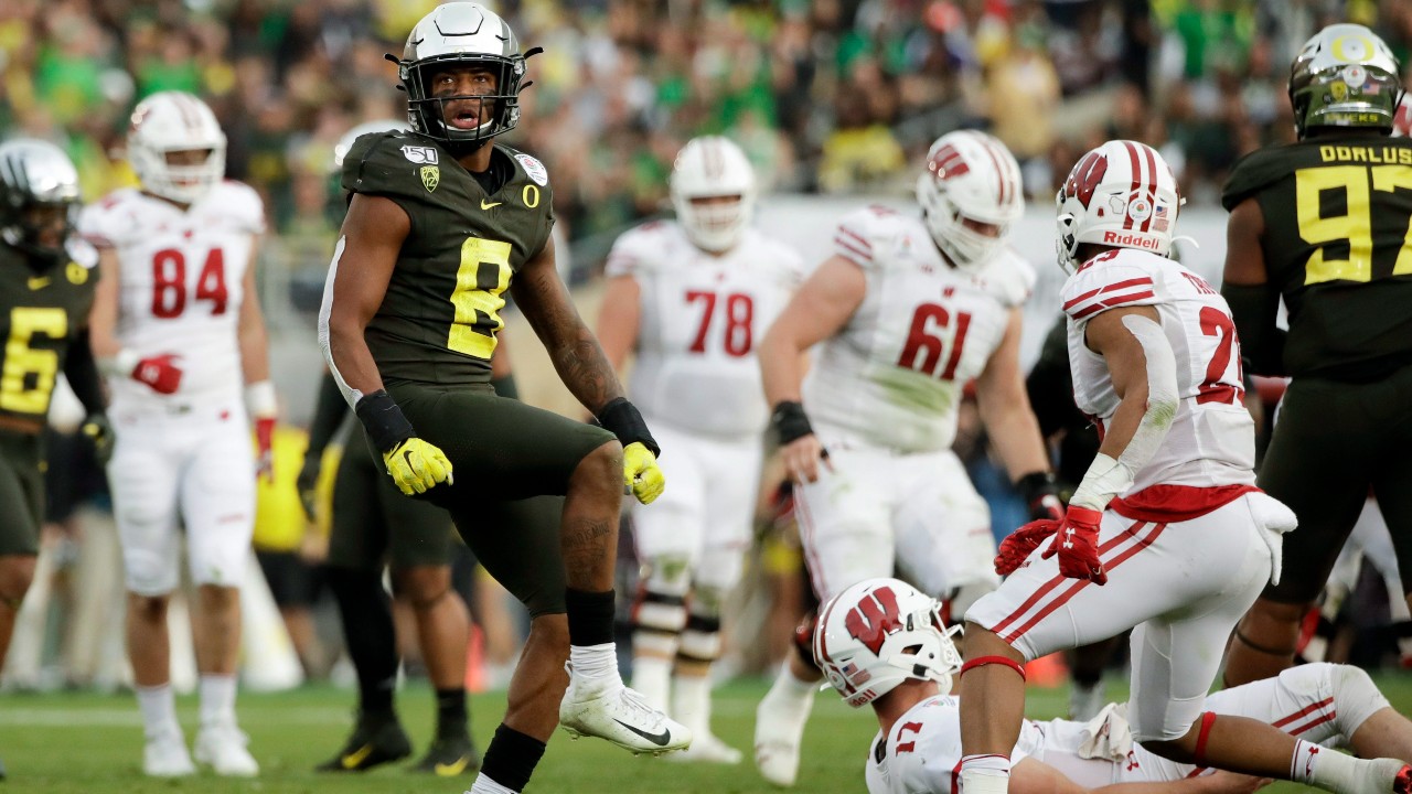 Oregon safety Jevon Holland celebrates after sacking Wisconsin quarterback Jack Coan during second half of the Rose Bowl NCAA college football game Wednesday, Jan. 1, 2020, in Pasadena, Calif. (Marcio Jose Sanchez / AP)
