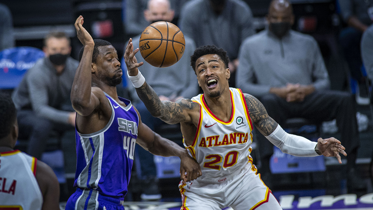 Sacramento Kings forward Harrison Barnes (40) defends against Atlanta Hawks forward John Collins (20) during the first half of an NBA basketball game in Sacramento. (Hector Amezcua/AP)