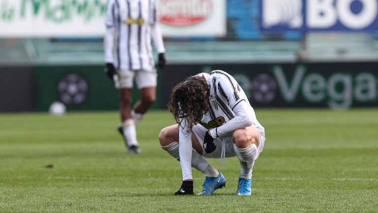Juventus' Adrien Rabiot squats on the pitch during a Serie A match against Atalanta. (Stefano Nicoli/LaPresse via AP)