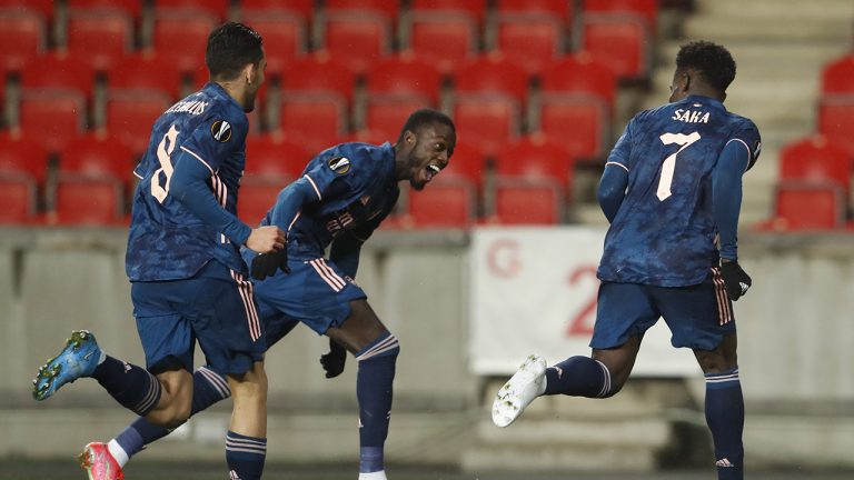 Arsenal's Bukayo Saka, right, celebrates with his teammates Arsenal's Nicolas Pepe, center, and Arsenal's Dani Ceballos after scoring his side's third goal during the Europa League quarter final second leg soccer match between Slavia Prague and Arsenal. (Petr David Josek/AP)