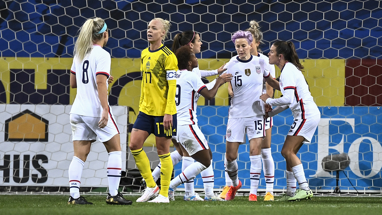 Megan Rapinoe (15) of USA celebrates with teammates after scoring a goal on a penalty kick during the women's international friendly soccer match between Sweden and USA. (Janerik Henriksson/TT via AP)