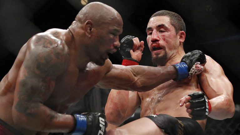 Robert Whittaker, right, and Yoel Romero fight during their middleweight title bout at the UFC 225 mixed martial arts event. (Jim Young/AP)
