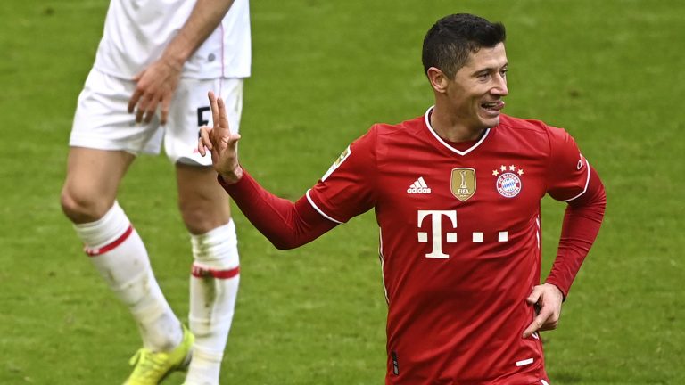 Bayern's Robert Lewandowski celebrates after scoring his sides fourth goal during the German Bundesliga soccer match between FC Bayern Munich and VfB Stuttgart. (Matthias Balk/Pool via AP)