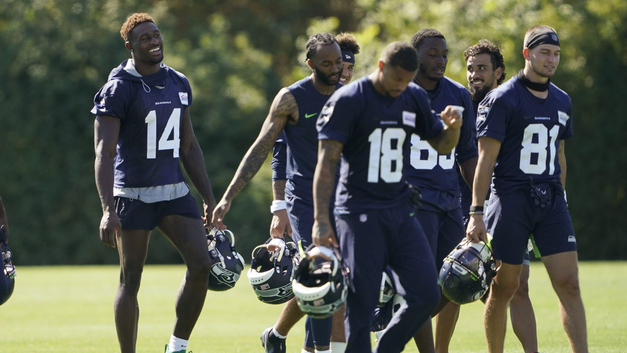 Seattle Seahawks wide receiver DK Metcalf (14) laughs as he walks with teammates on the last day of NFL football training camp for the team in 2020. (Ted S. Warren/AP)
