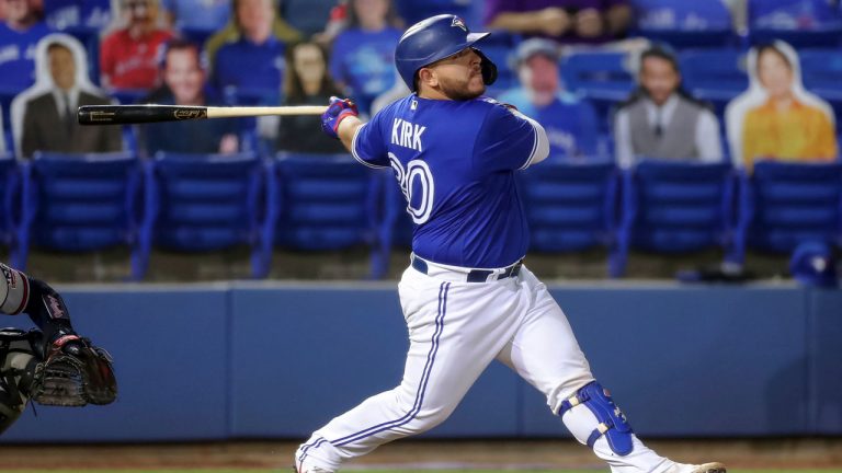 Toronto Blue Jays' Alejandro Kirk follows through on a two-run home run against the Atlanta Braves during the fifth inning of a baseball game. (Mike Carlson/AP)