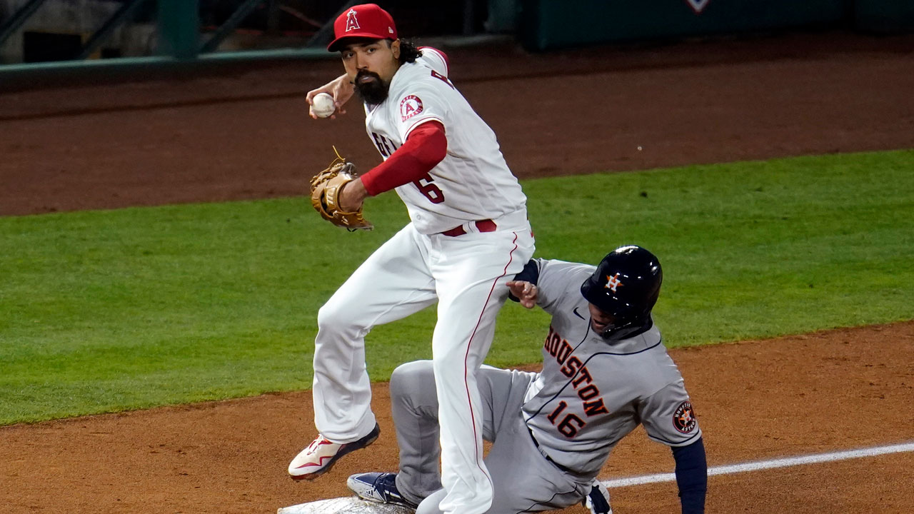 Houston Astros' Aledmys Diaz (16) is forced out at third base by Los Angeles Angels third baseman Anthony Rendon. (Marcio Jose Sanchez/AP)