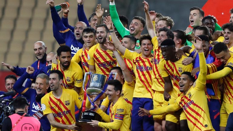 Barcelona players hold the trophy as they celebrate after winning the Spanish Copa del Rey final 2021 against Athletic Bilbao at La Cartuja stadium in Seville, Spain, Saturday April 17, 2021. (Angel Fernandez/AP)