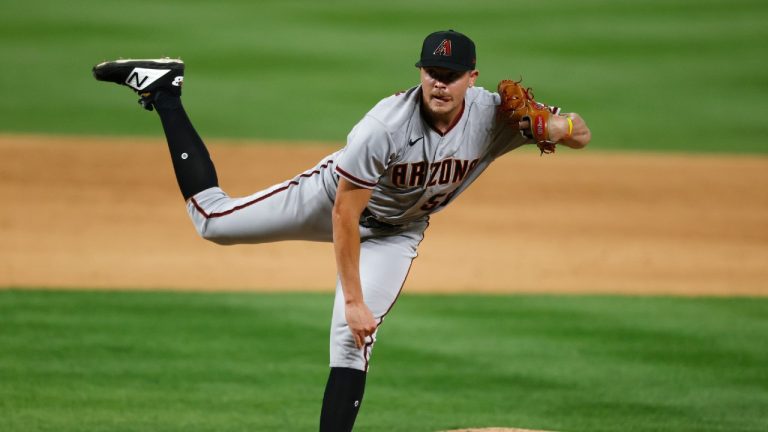 Arizona Diamondbacks relief pitcher Jeremy Beasley works against the Colorado Rockies during the eighth inning of a baseball game Tuesday, Aug. 11, 2020, in Denver. The Rockies won 8-7. (David Zalubowski/AP)