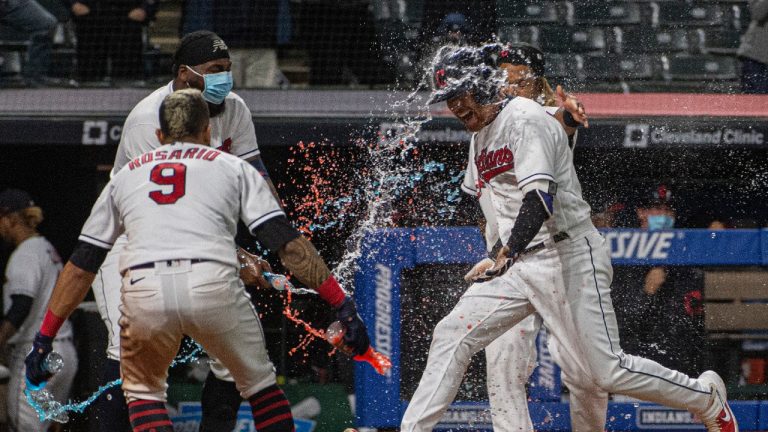 Cleveland Indians' Jordan Luplow gets drenched by Eddie Rosario and his teammates after hitting a two-run home run off Minnesota Twins relief pitcher Alex Colome during the tenth inning of a baseball game in Cleveland, Monday, April 26, 2021. (Phil Long/AP)