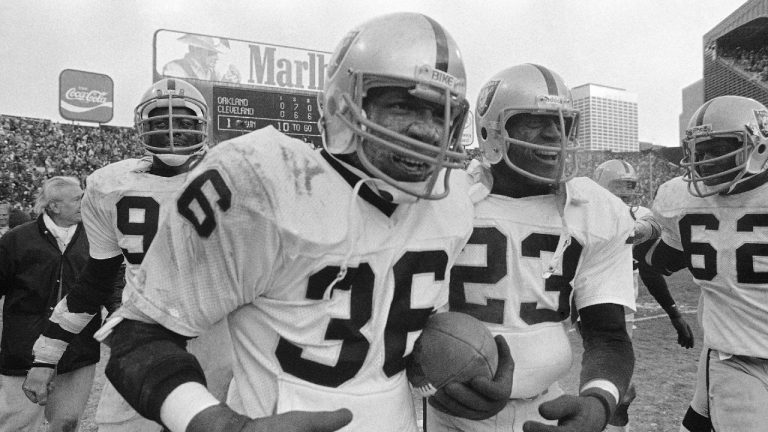 In this Sunday, Jan. 5, 1981 file photo, Oakland Raiders safety Mike Davis (36) runs off the field with the ball after intercepting a pass from Cleveland Browns quarterback Brian Sipe in the end zone with a few seconds left in AFC playoff football game in Cleveland. (Brian Horton, File/AP)
