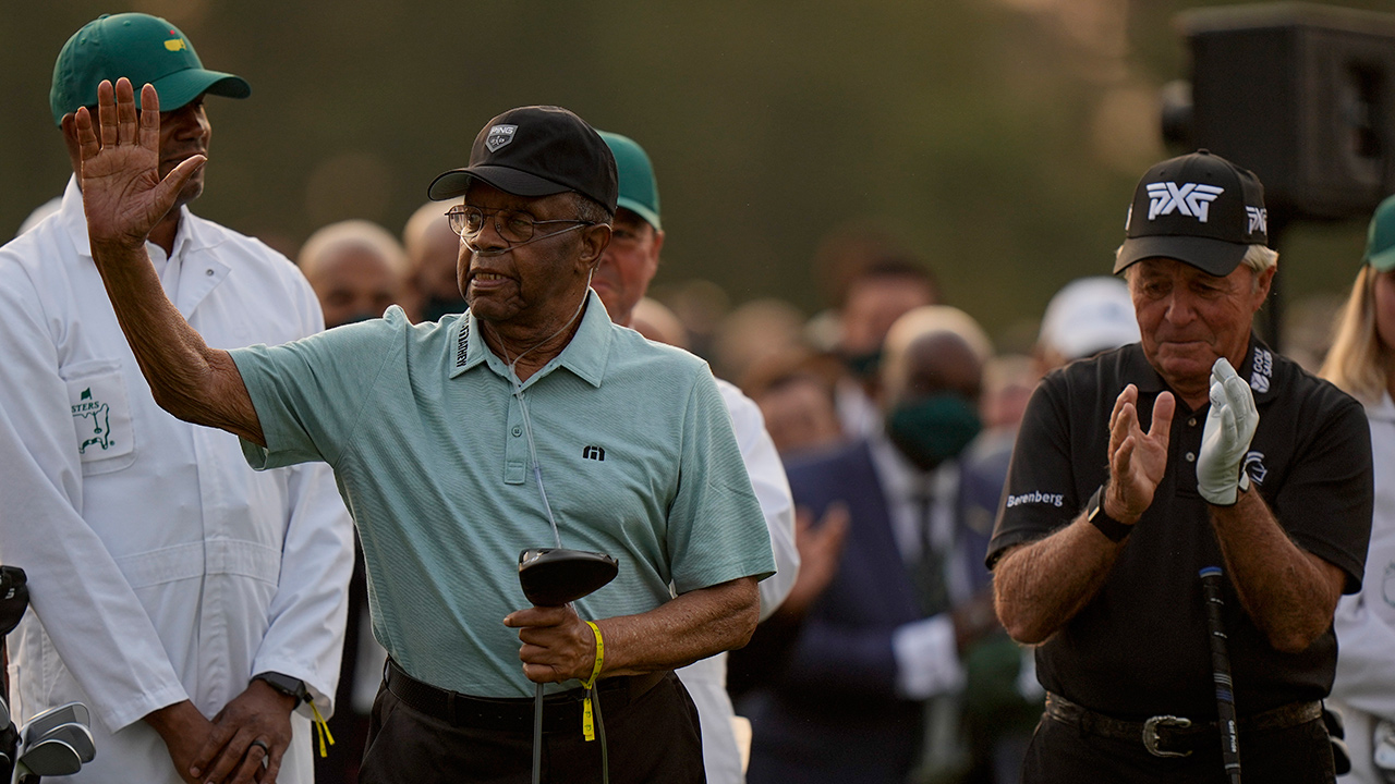 Lee Elder waves with Gary Player before the ceremonial first tee the first round of the Masters golf tournament on Thursday, April 8, 2021, in Augusta, Ga. (Matt Slocum/AP)