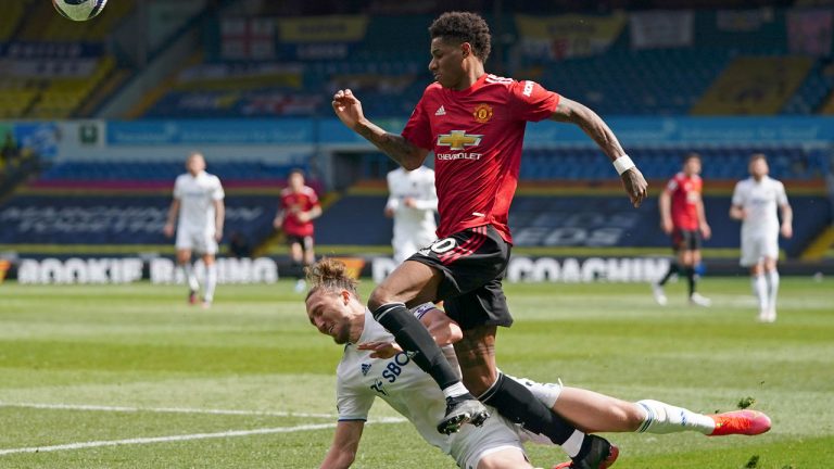Leeds United's Luke Ayling fouls Manchester United's Marcus Rashford during the English Premier League soccer match between Leeds United and Manchester United. (Jon Super/AP)